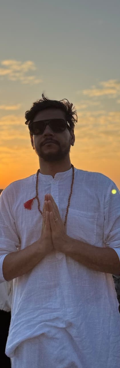 Arun leading a quiet sunset practice in Rishikesh